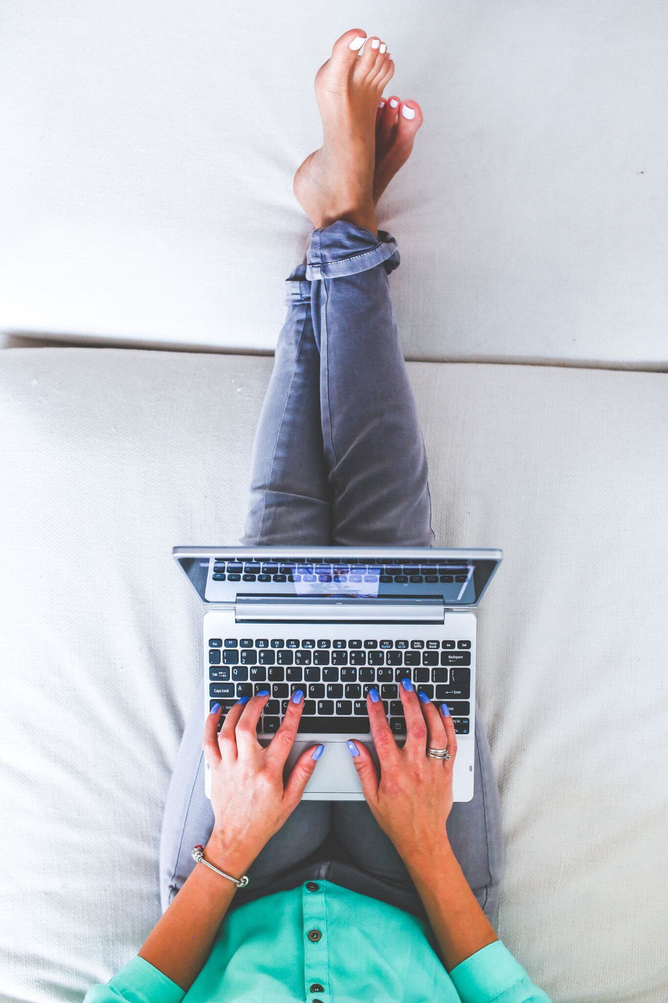 Content writer working from home on her laptop.